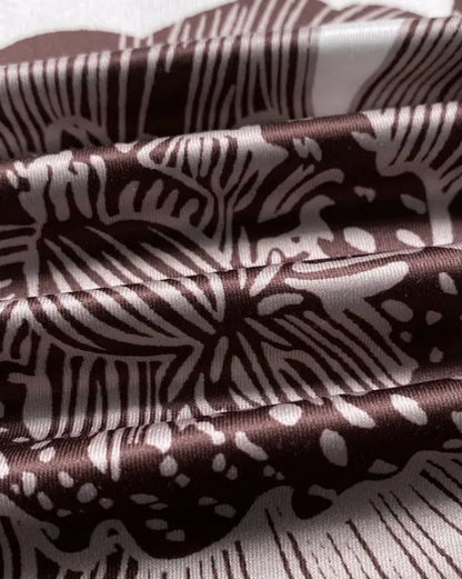 Combi-pantalon à bretelles ajustables avec imprimé floral et design à poches, jambe large